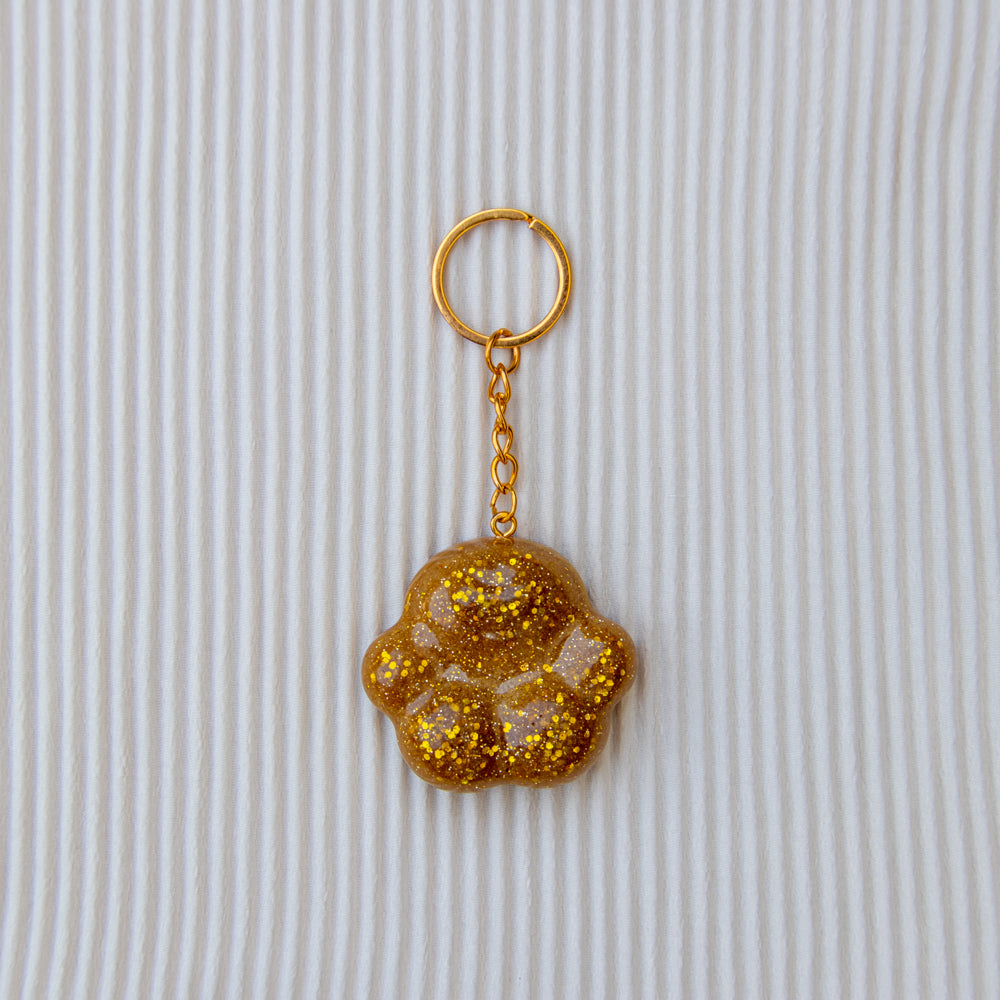 Porte clés patounette gold paillettes