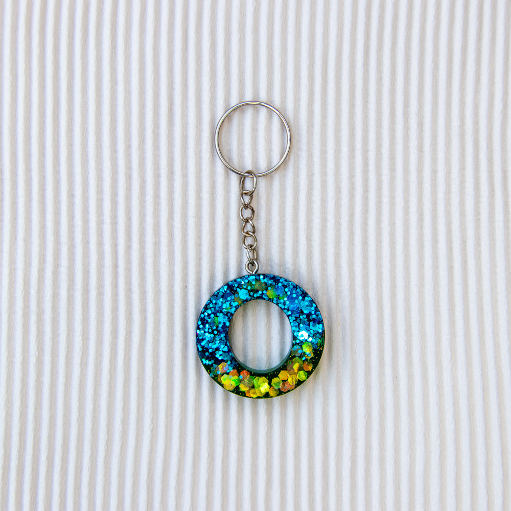 Porte-clés lettre O bleu vert transparent paillettes