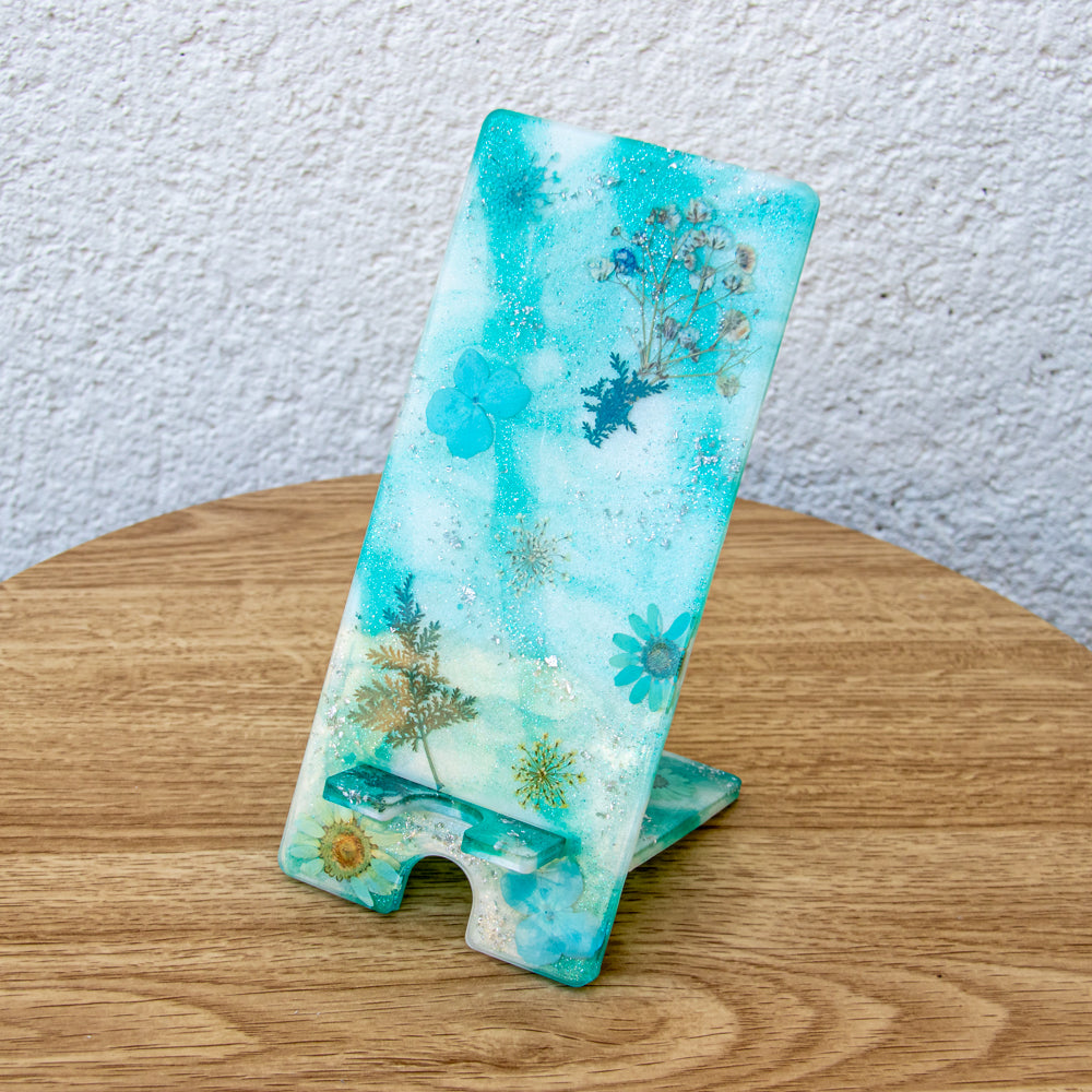 Support téléphone bleu avec fleurs