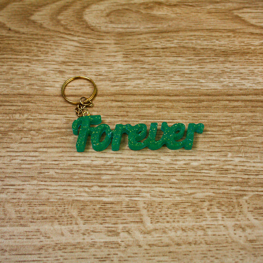 Porte clés " forever " vert paillettes