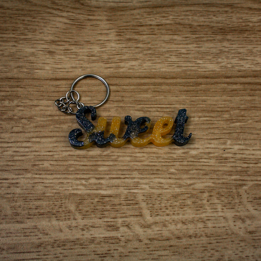 Porte clés " sweet " noir et jaune paillettes