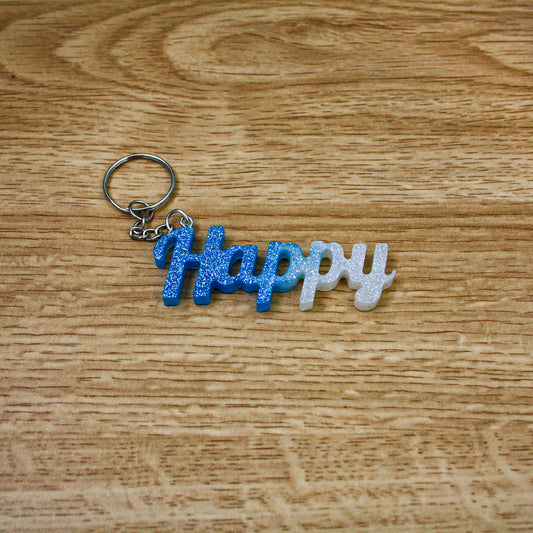 Porte clés " happy " bleu blanc paillettes