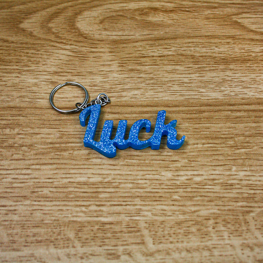 Porte clés " luck " bleu paillettes