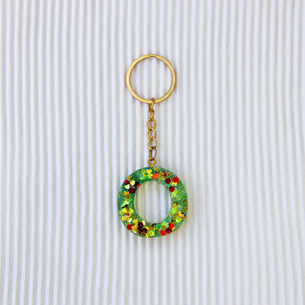 Porte-clés lettre O vert transparent paillettes