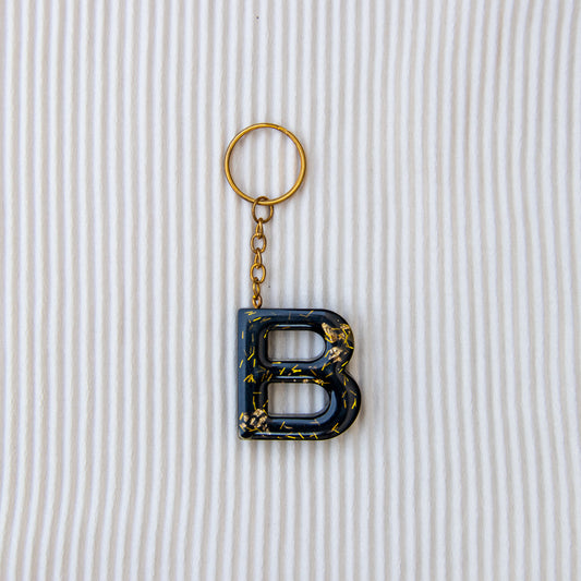 Porte-clés lettre B noir à paillettes or