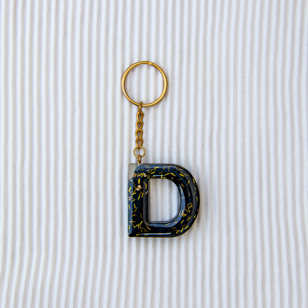 Porte-clés lettre D noir paillettes or