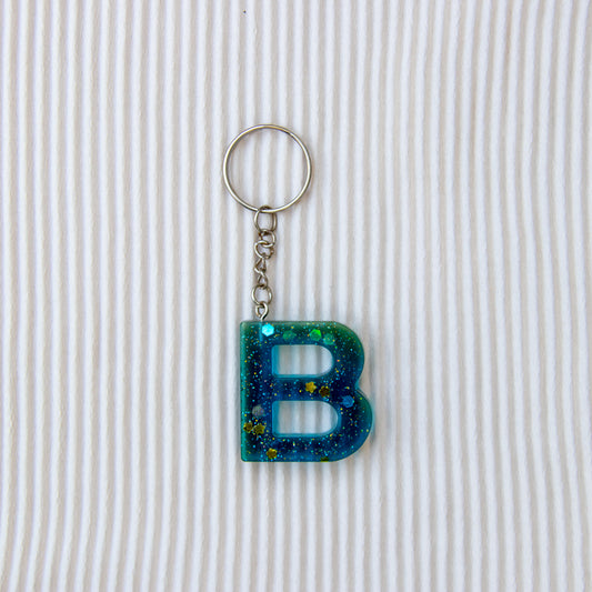 Porte-clés lettre B bleu transparent à paillettes